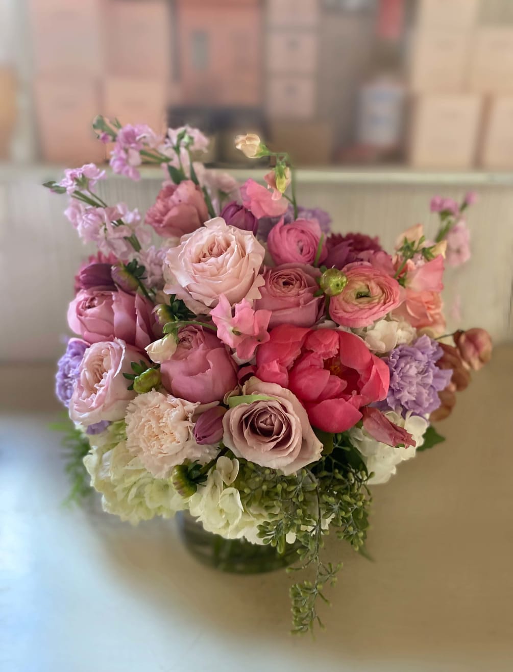 Beautiful and timeless, classic and whimsical arrangement in gorgeous violet and pink