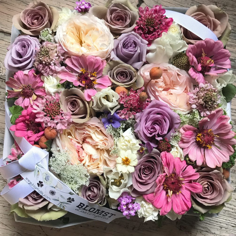 Beautiful signature Blomst flower box full of fresh flowers in a happy