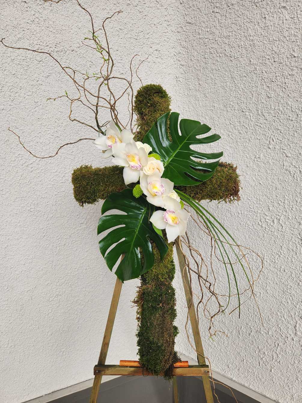 A cross made with moss 