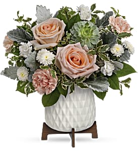 Make a stylish statement with this unique bouquet of peach blooms and