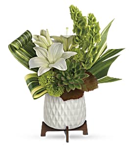 Celebrate with style! Presented in a mid-century ceramic planter with unique geometric
