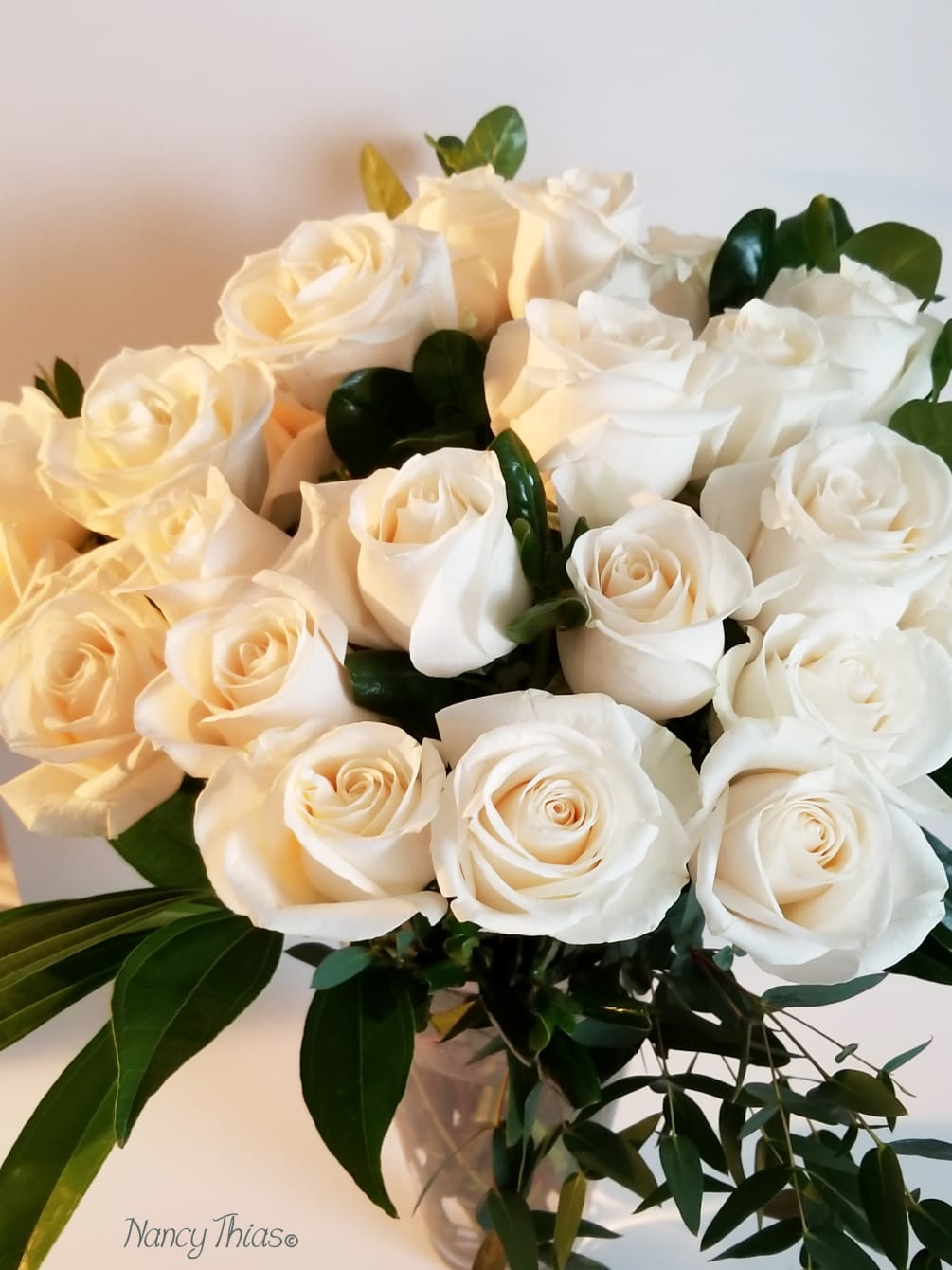 24 Beautiful cream roses in a French vase