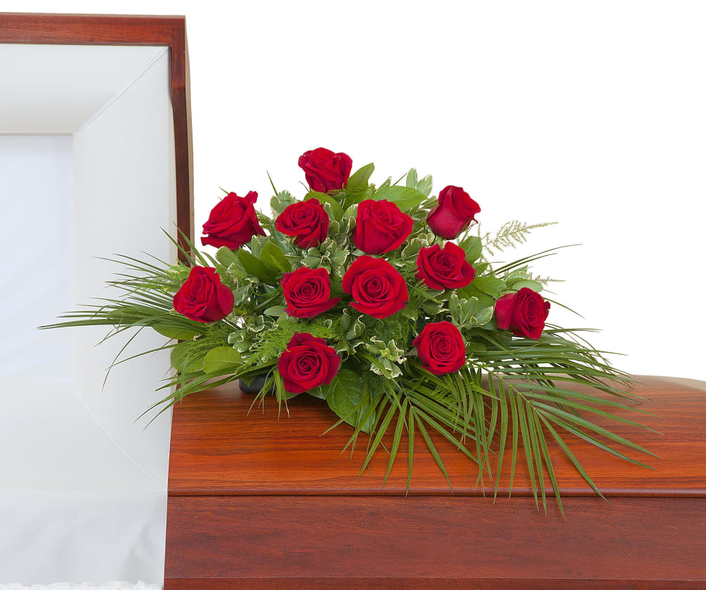 One dozen Roses in a casket spray. Approximately 16&quot;W 12&quot;D