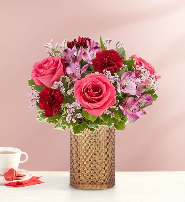 EXCLUSIVE The essence of romance, captured in flowers. Our striking bouquet is