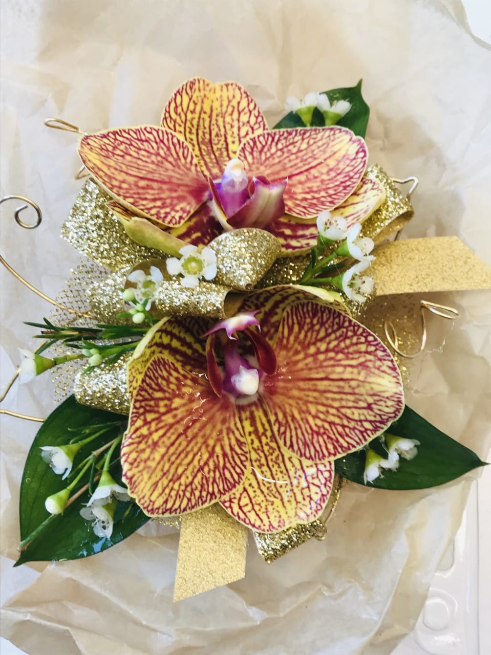 A double orchid wristlet made with the most beautiful orchids on the