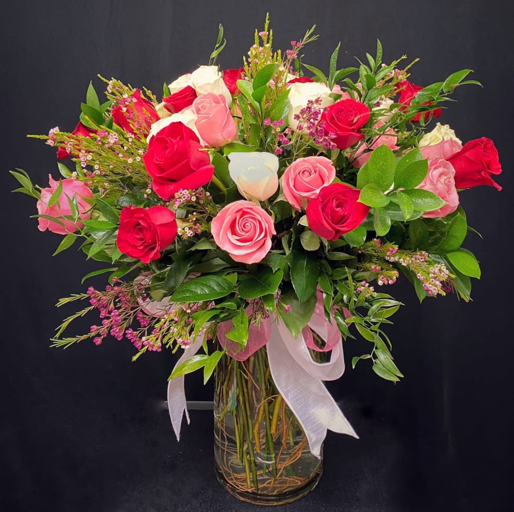 Translated... Hugs and Kisses! Mix color roses make for a classical statement