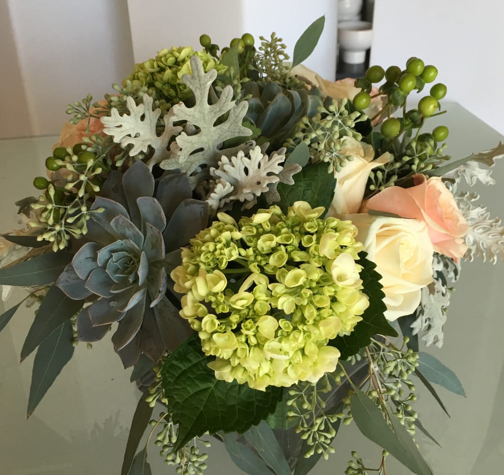 Silver succulents with Dusty Miller, peach roses, green coffee beans, green hydrangeas