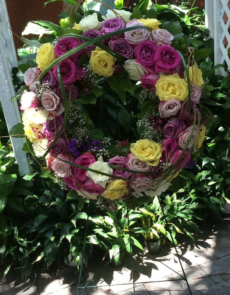 A Wreath of Multiple Color Roses To Celebrate The Memory of A