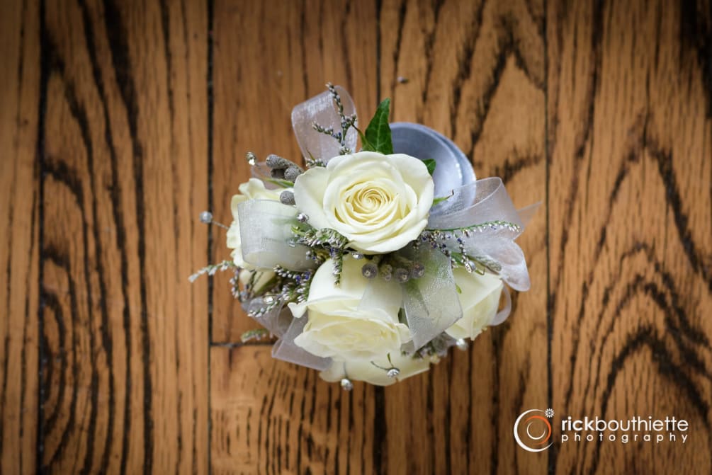 Shown as Standard
White spray roses, caspia greens gems and silver ribbon come