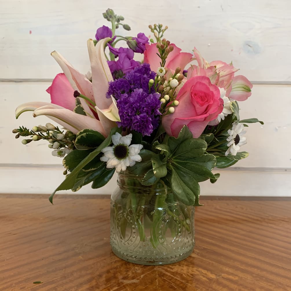 Pink roses, stargazer lily, purple stock, pink alstromaria, and white yinyang arranged