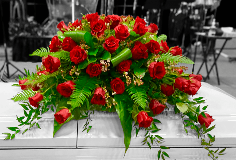 This beautiful casket spray is composed of 4 dozen Red Rose blooms