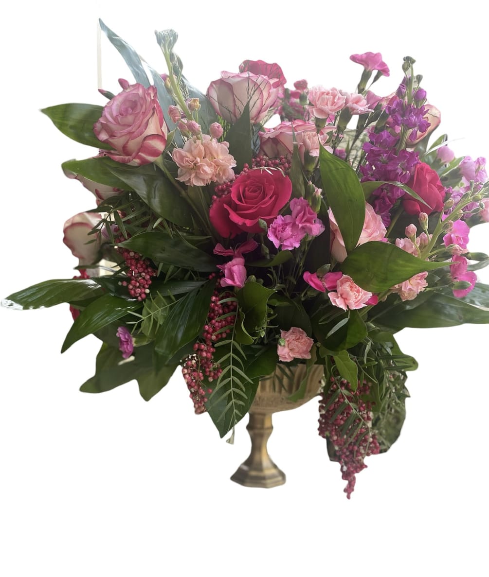 A Lucious arrangement of florals in pink tones in a vintage inspired