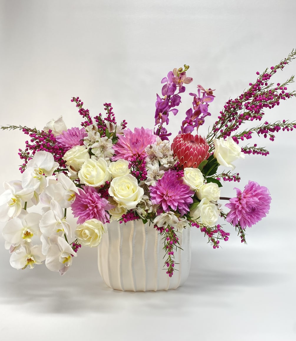 Large and Elegant high end floral arrangement with large orchids in white