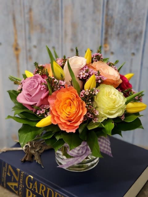 Soft spring tone roses and tulips with seasonal textures, hand designed in