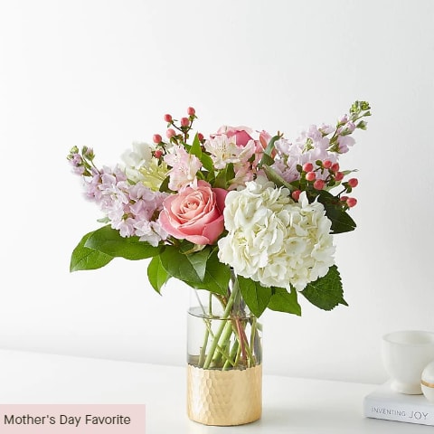 Tickle them pink with this elegant arrangement of roses, alstroemeria, hypericum berries