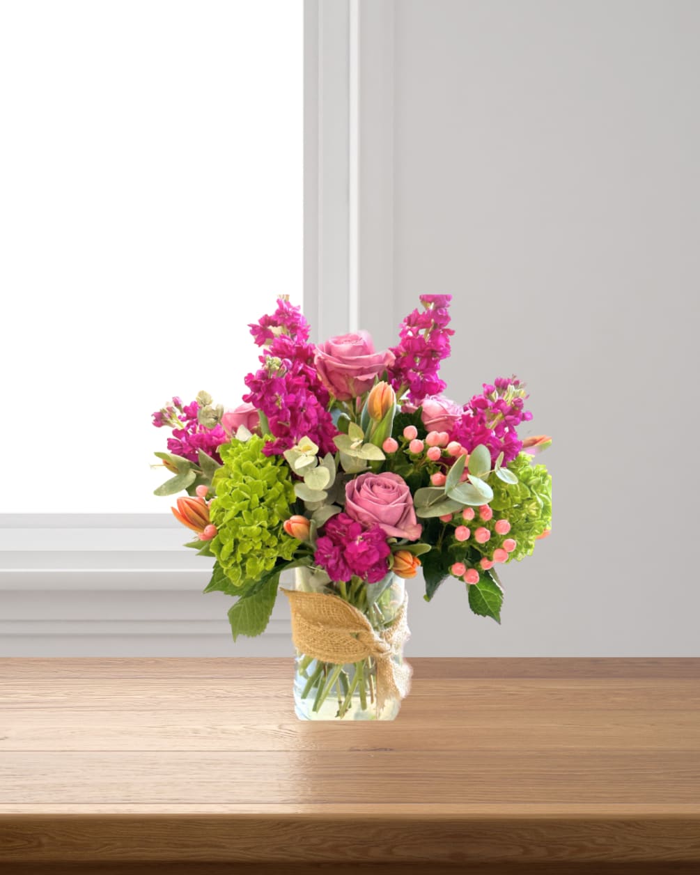 Lavendar roses, Pink Stock, Hydrangea, Tulips and Eucalpytus and hypericum berries. This