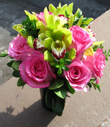 A splendid arrangement of roses and orchids