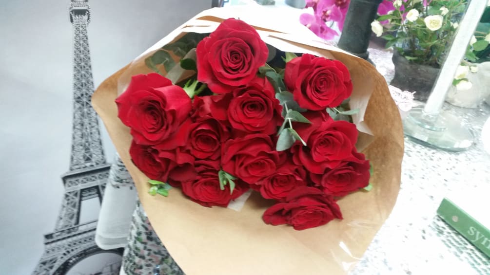 1 dozen long stem PREMIUM QUALITY imported roses wrapped in a brown