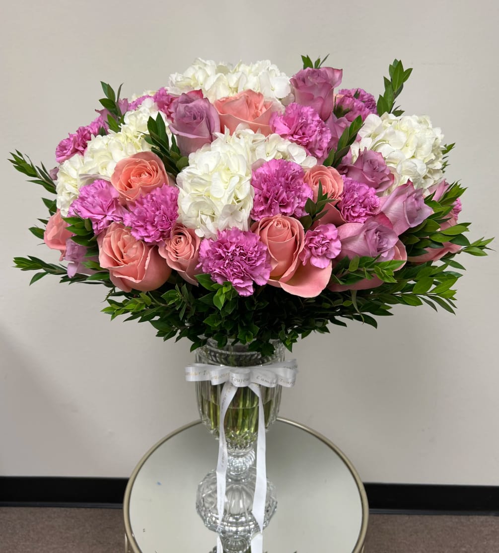 Luxurious mix of peonies, roses, hydrangeas and carnations in an exclusive 