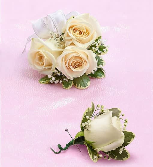 Wristlet Corsage: Three white roses adorned with baby&#039;s breath and white ribbon
Boutonniere: