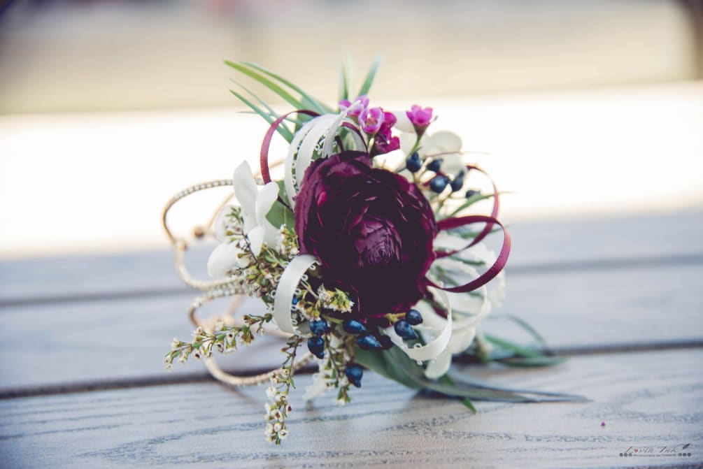 Wrist corsage with ranunculas (seasonal) but can be made with other fresh