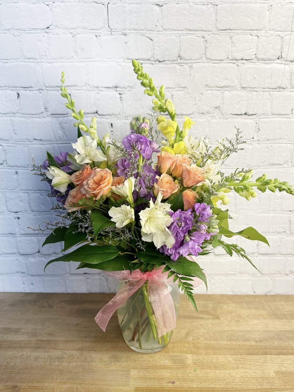 Our popular Valentine&#039;s bouquet, remade for Spring! A One-sided Arrangement. Includes spray