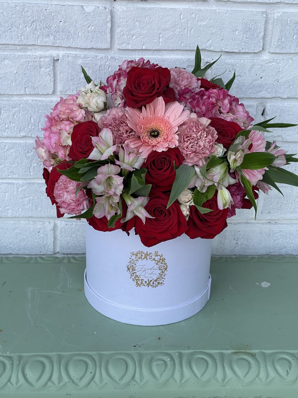 This beautiful box is filled with roses, carnations, hydrangeas, and a different