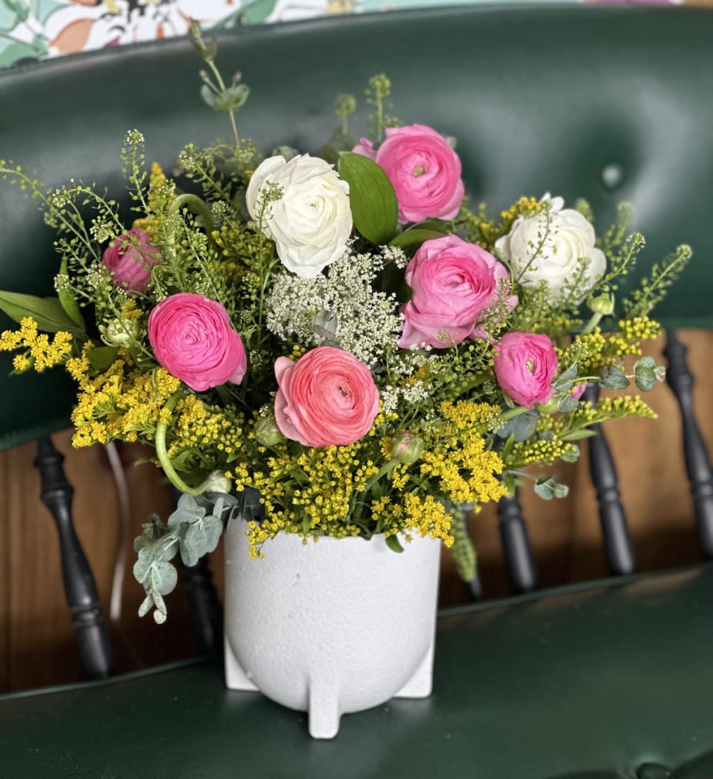 10 spring assorted color ranunculus accented with  solidago, greenery and eucalyptus