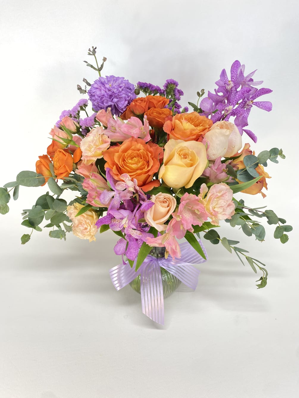 Cute and bright flower arrangement  with a seasonal tones of Orange