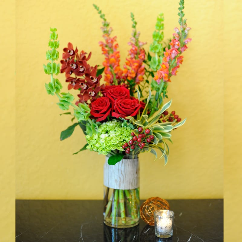 This tall contemporary style arrangement is the perfect compliment for that Bold