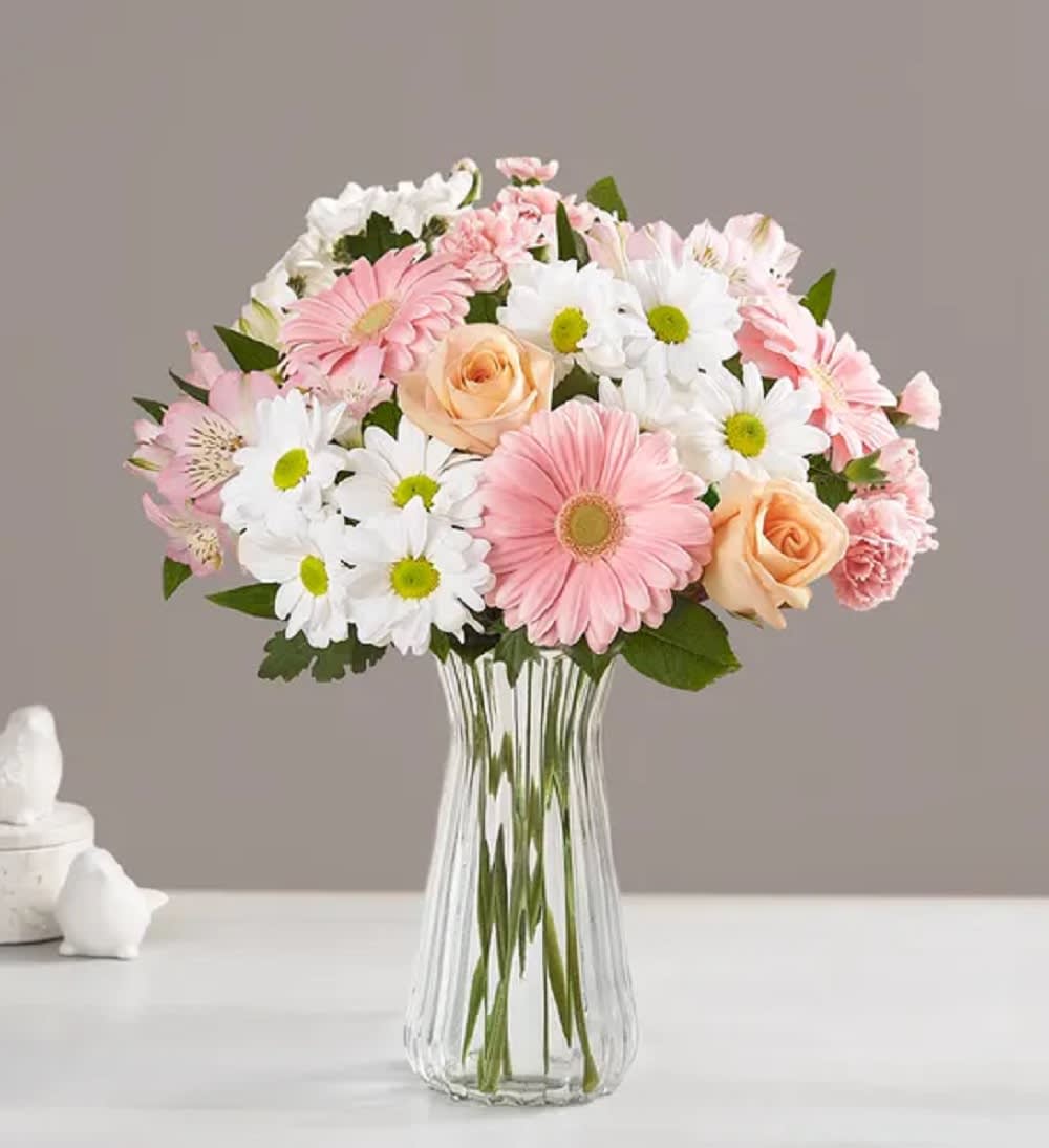 Our soft-hued gathering of pink, peach, and white blooms is designed to