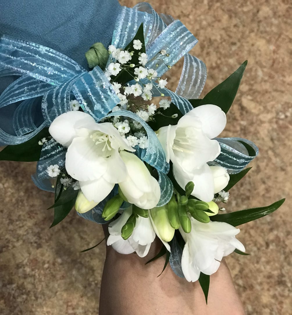 Freesia corsage with baby breath.