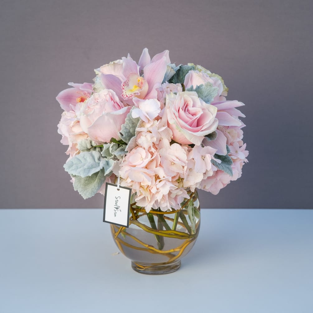 A delicate mixture of sweet and soft pastel pinks featuring light pink