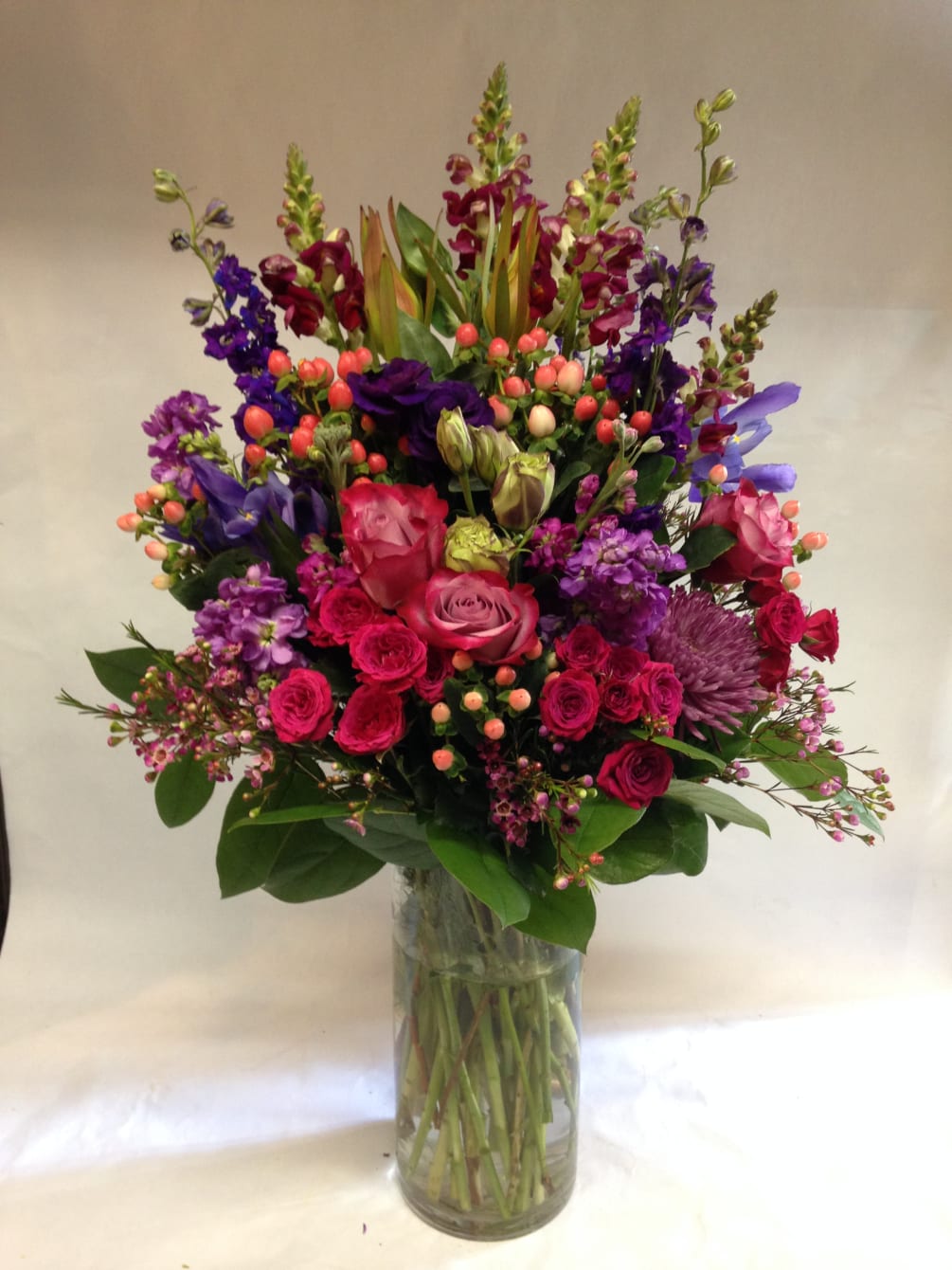 This large arrangement comes complete with lavender roses, snap dragons, lisianthus, belladonna
