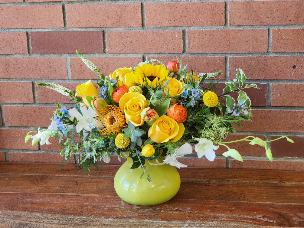 The name describes this absolutely stunning and vibrant bouquet or yellow roses