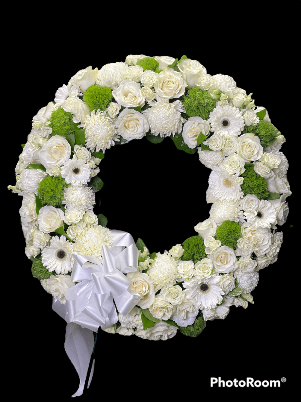 A beautiful standing  wreath with white and green flowers