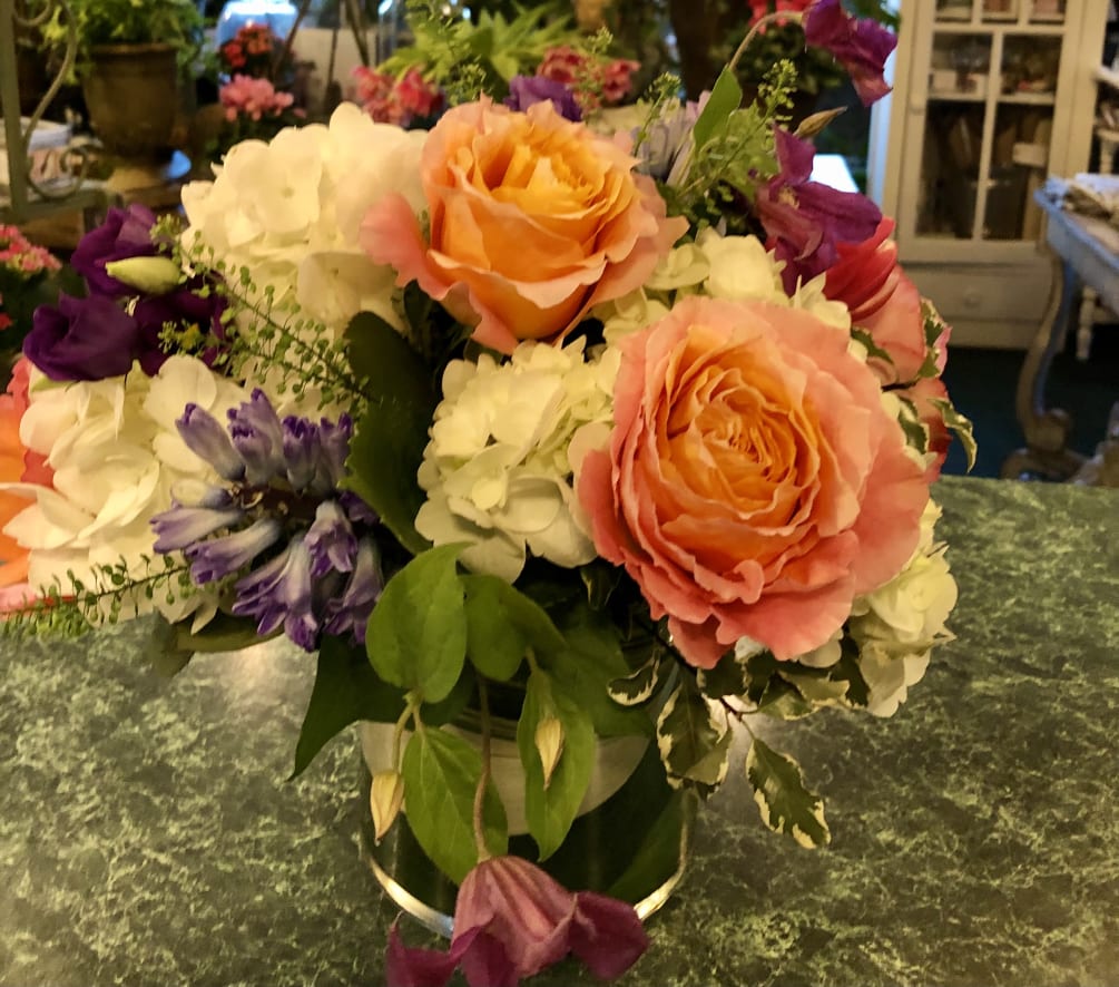 Lovely arrangement of Free Spirit roses, white hydrangeas, blue hyacinth, Columbus tulips