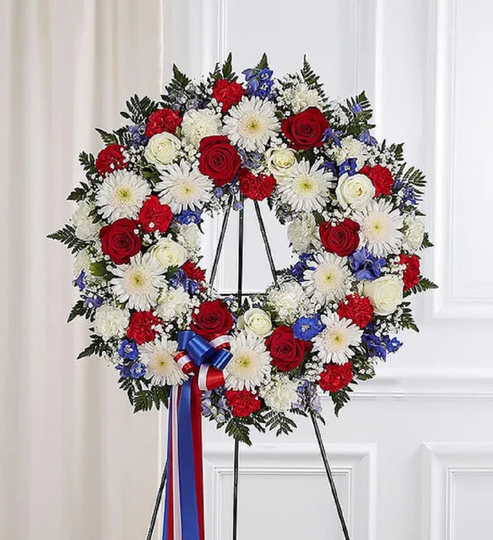 &bull;	Our standing wreath arrangement is meticulously crafted by our expert florists to