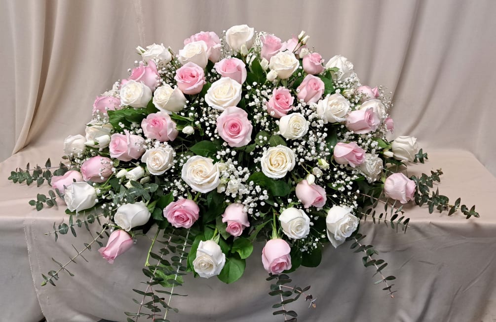 Light pink and white roses with touches of babies breath