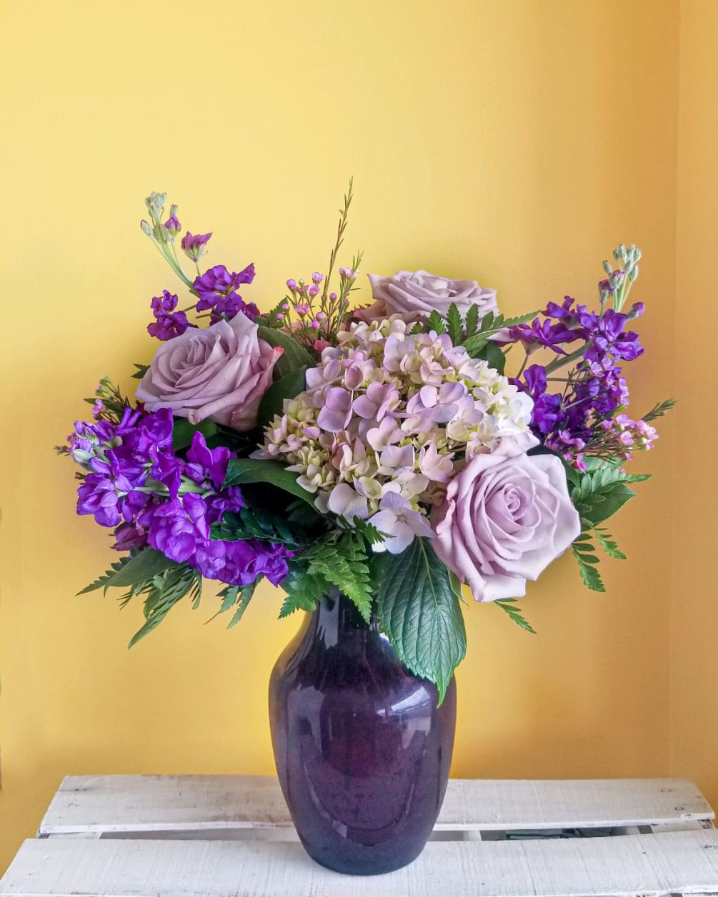 A Designers Choice of various shades of purple flowers.  Using the
