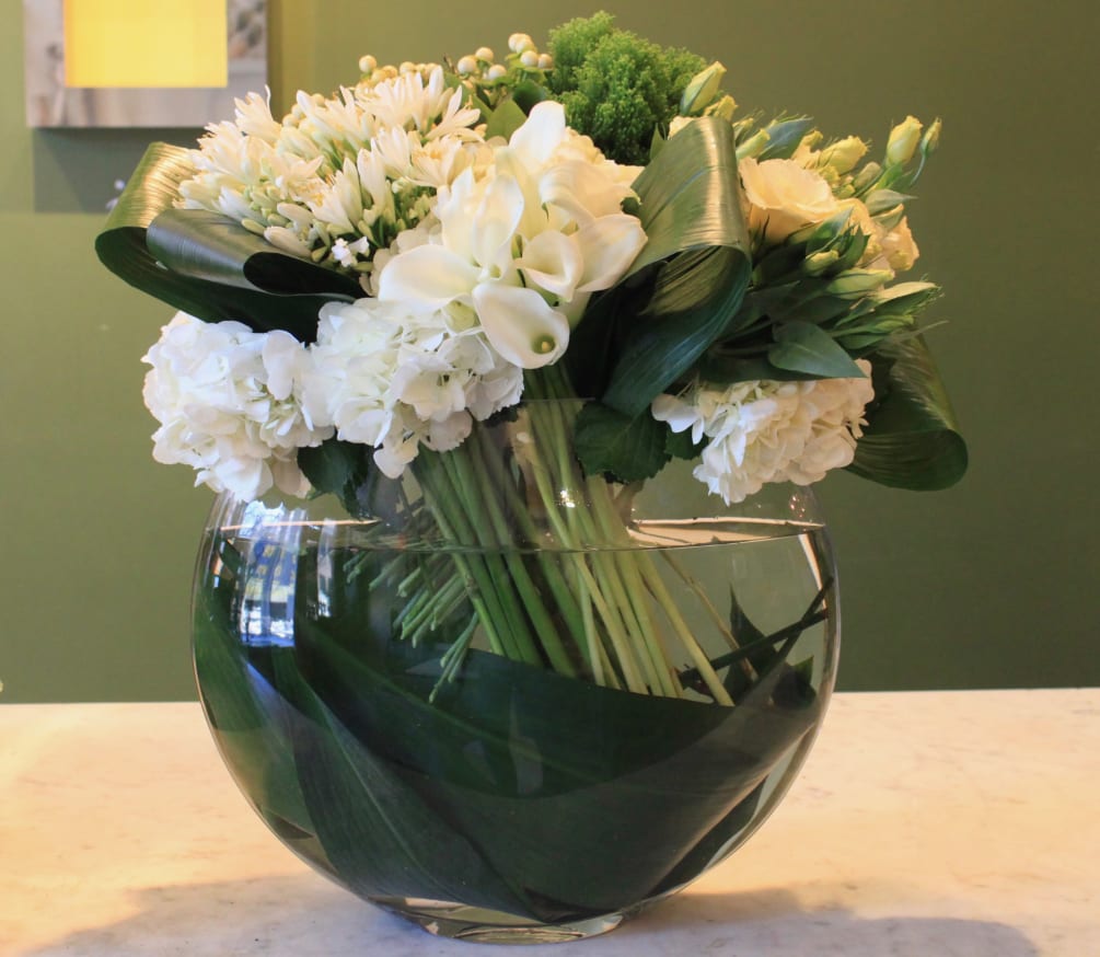 Layers of white blooms set apart with looped leaves for a touch