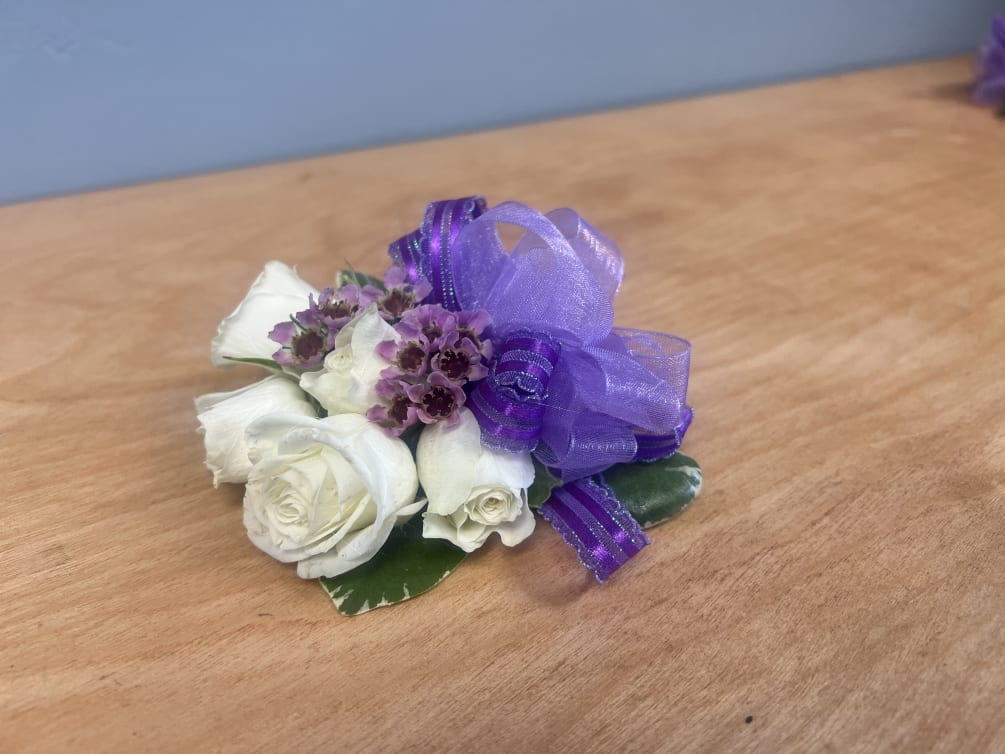 Lavender Corsage, with white spray roses, wax, and lavender ribbon.