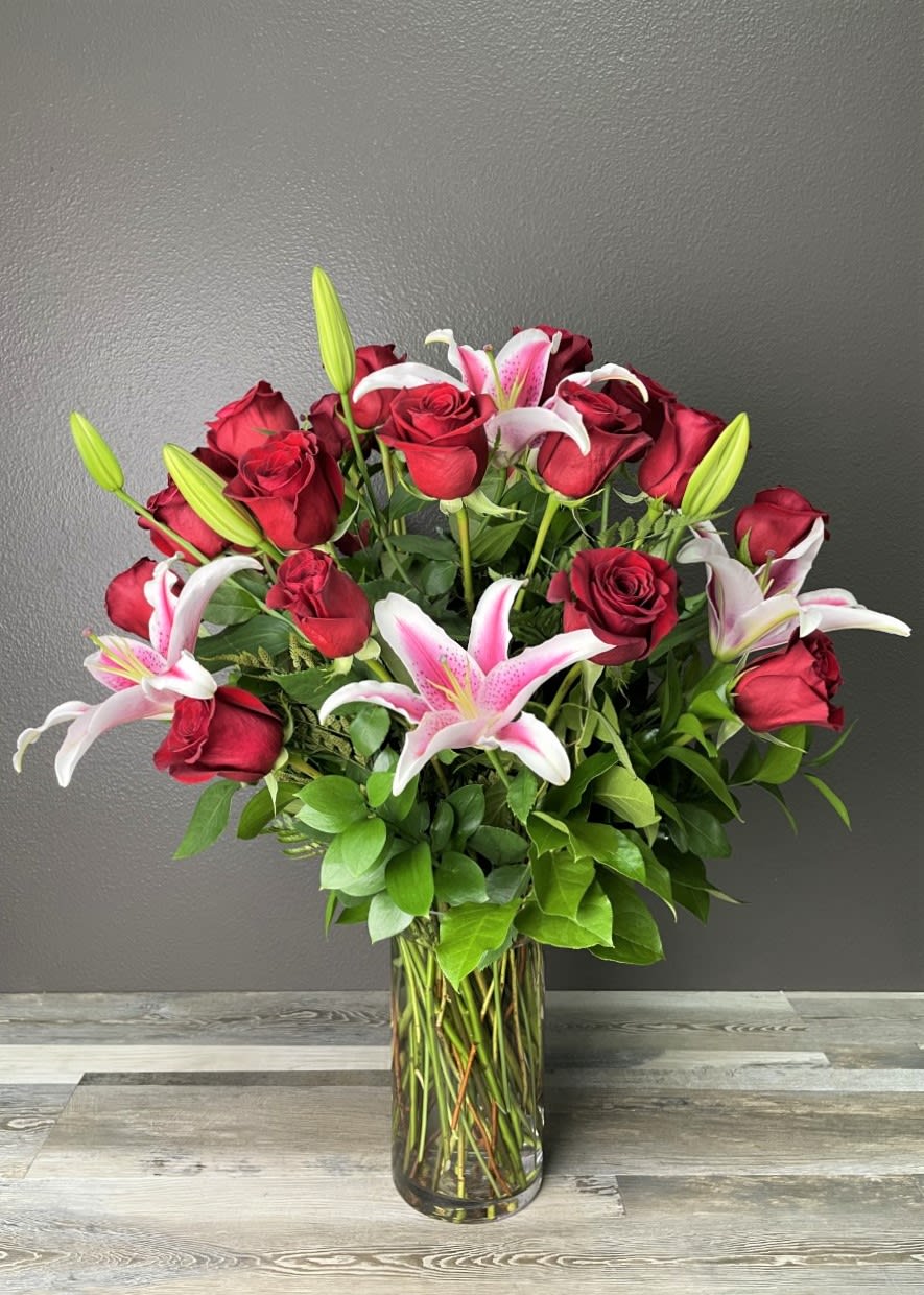 Includes 24 beautiful long stem red roses arranged in a clear glass
