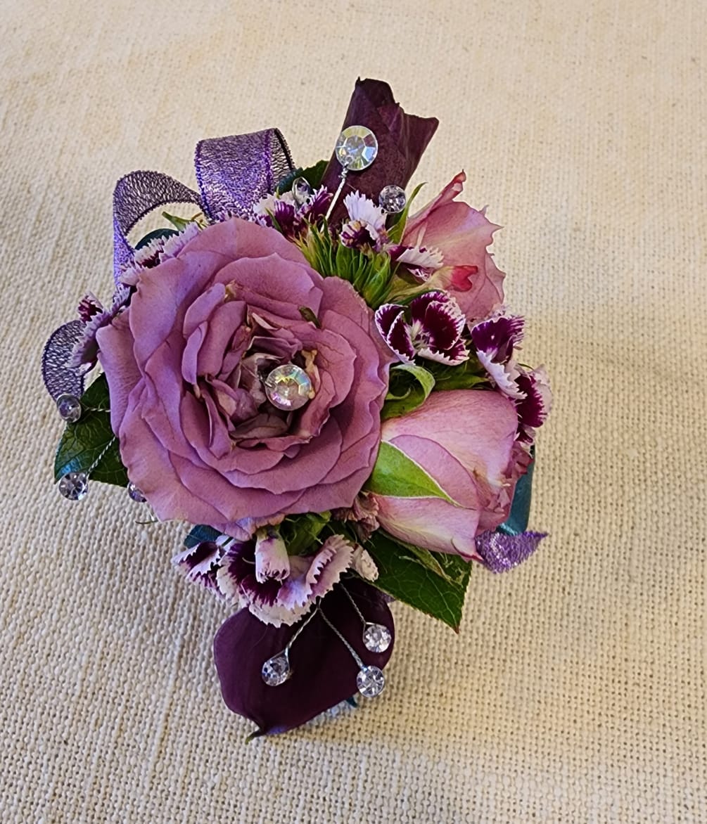 Sparkle the night away with this elegant lavender rose wrist corsage.