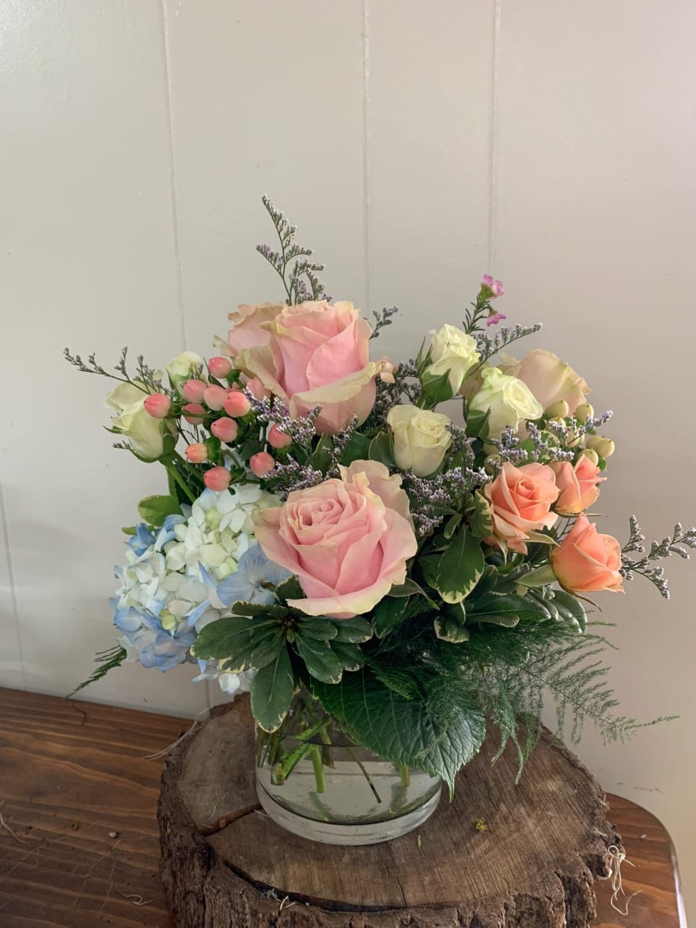 Pastel flowers make this arrangement perfect for those moments in life that