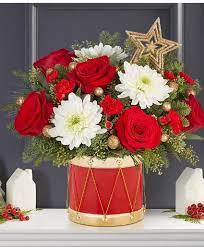 Perfect for the holiday season, this arrangement is sure to get you