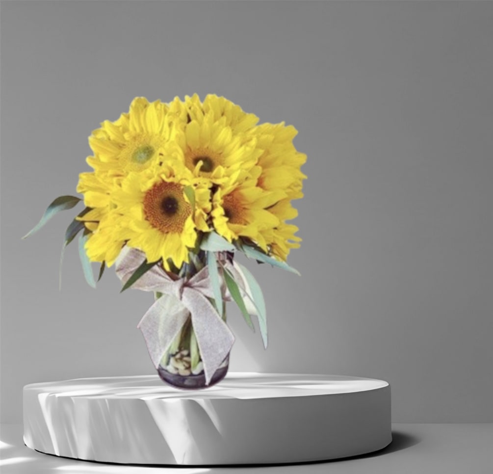 An all around bright and cheerful arrangement created with beautiful Sunflowers in