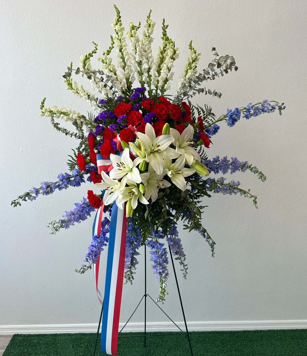 Patriotic standing spray is perfect to honor our heroes 
