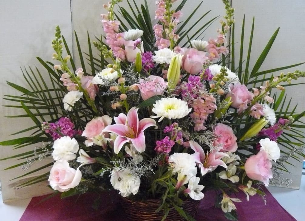 Roses, Snapdragons, Cremons, Carnations, Lilies, Stock, Palms, Fancy Greens