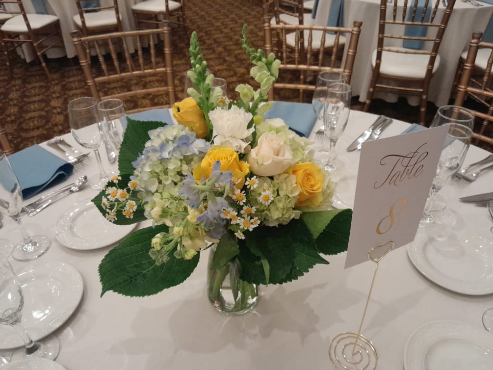 Country fresh Angelica centerpiece of blue and white hydrangea, yellow roses, light